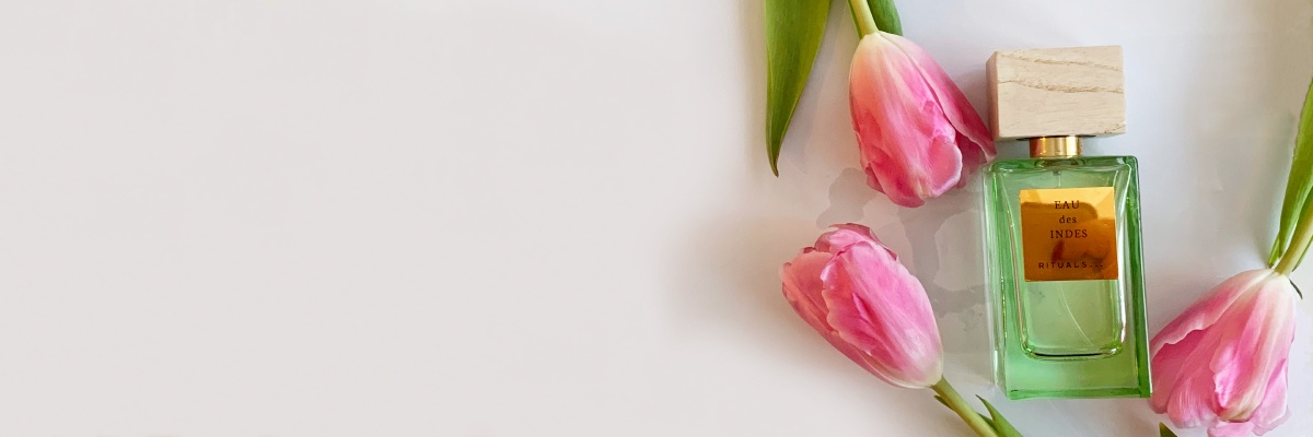 En grön parfymflaska av märket Rituals